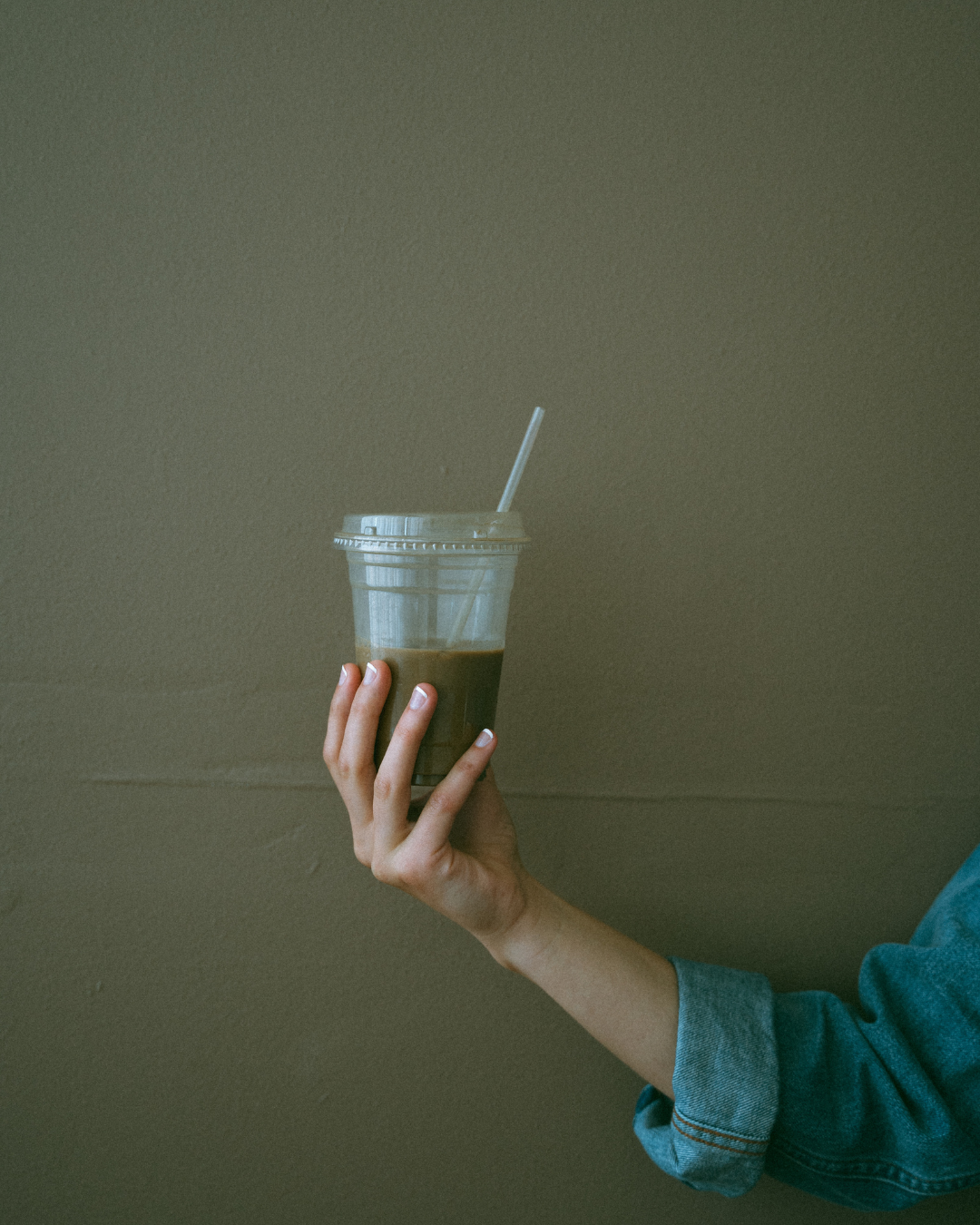 Social media manager is holding a coffee